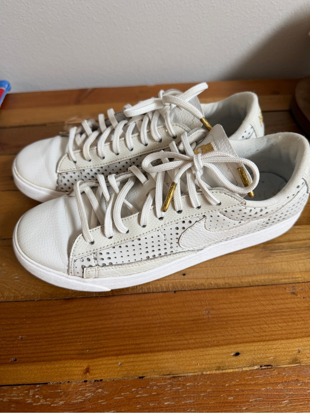 Nike Women’s White Perforated Low-Top Sneakers with Gold Eyelets